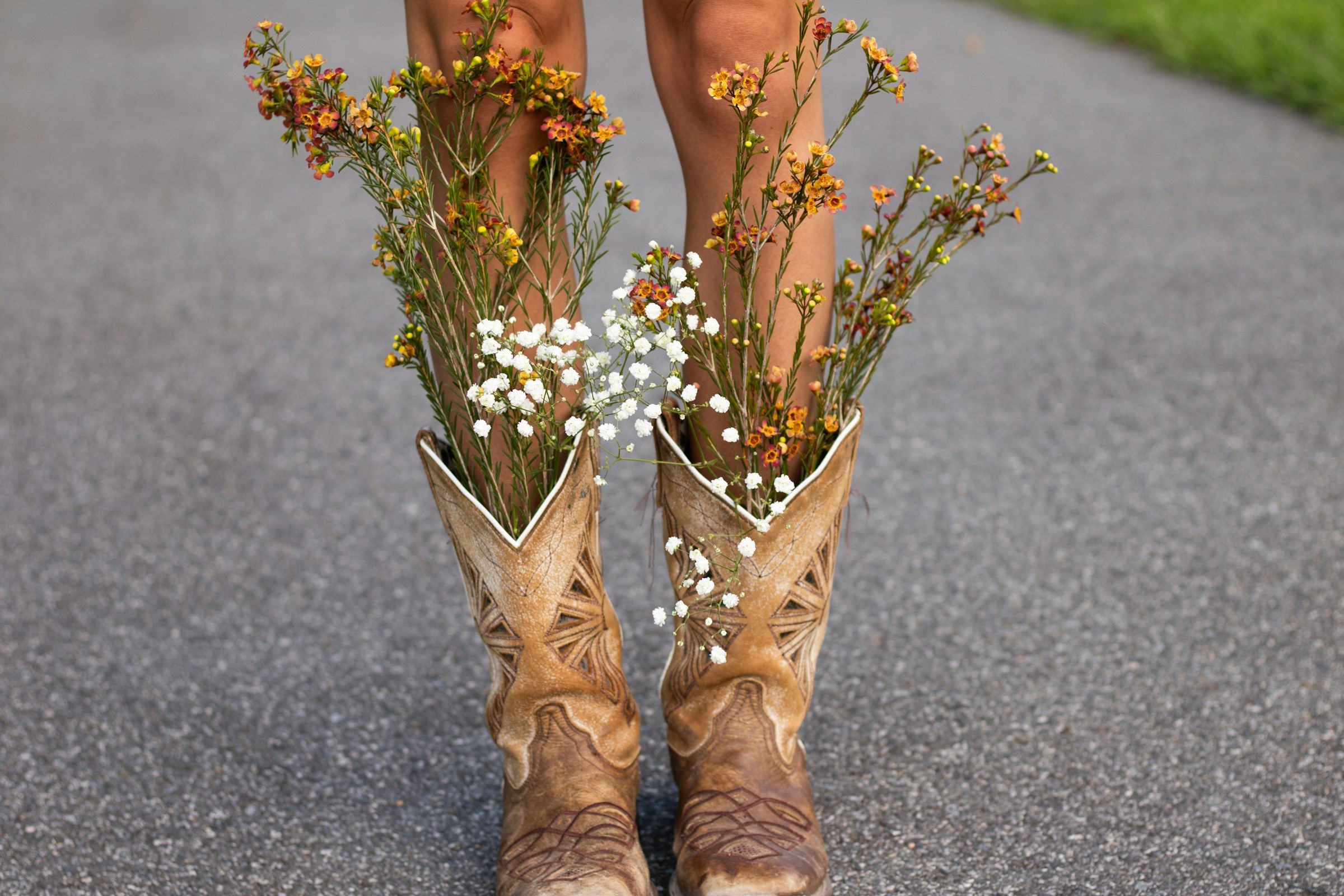 Cowboy boots filled with wildflowers