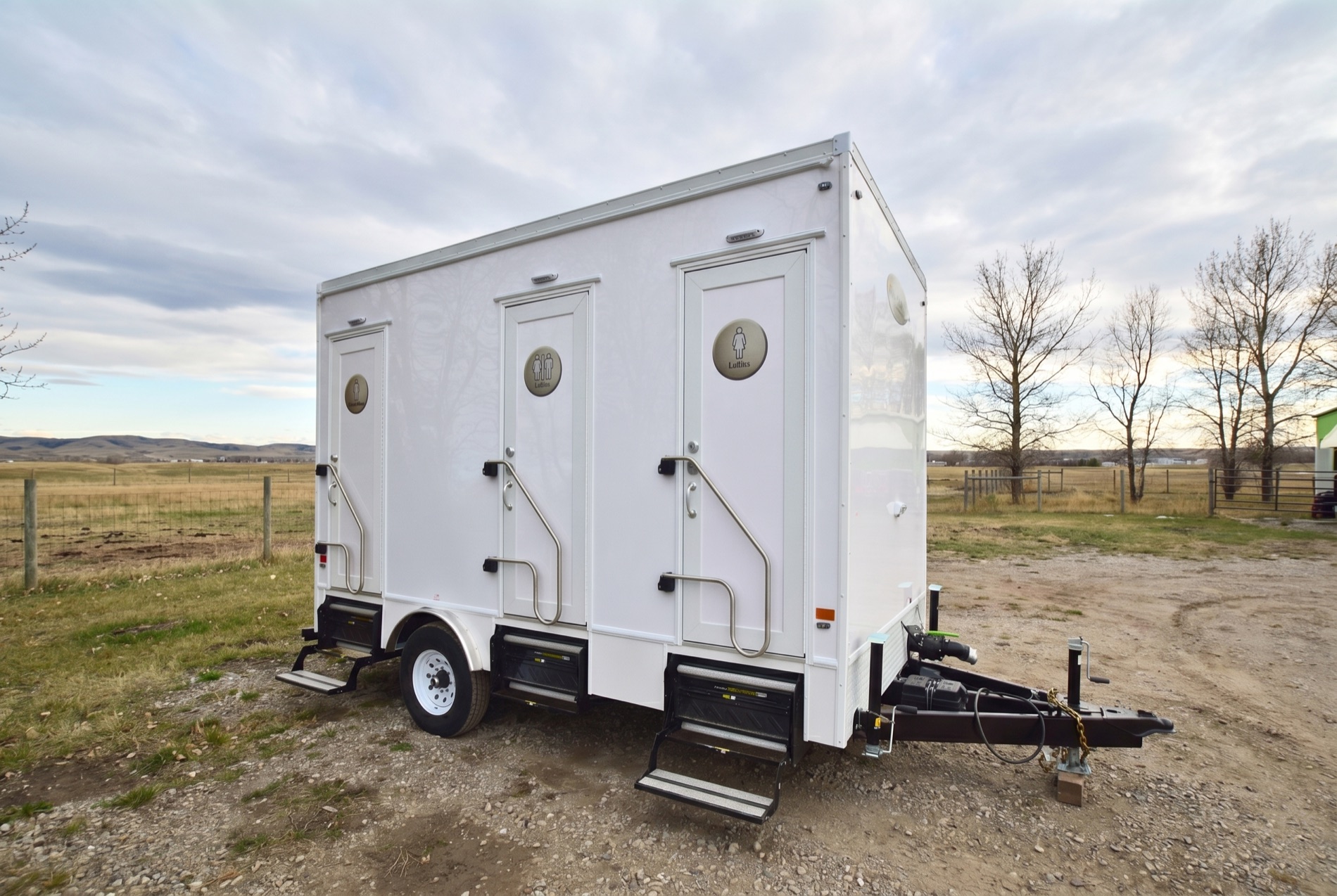 Luxury three-stall washroom trailer parked at an acreage near Calgary